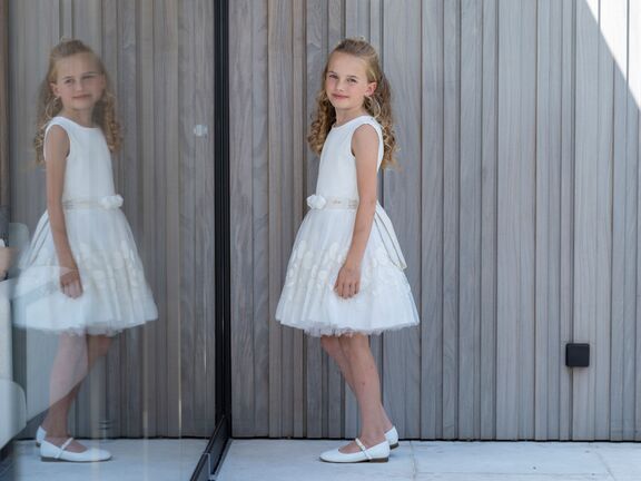 wit kleed gouden bloemetjes meisjes Gymp communiecollectie lentefeestcollectie 2024 bij Kameleon in 